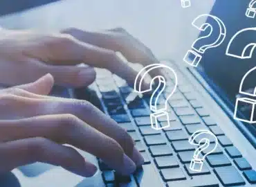 Hands typing on keyboard.