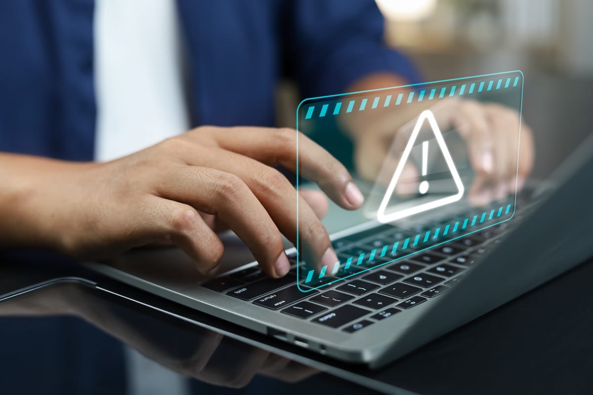 IT technician monitoring network security for a Prairie Village, Kansas business